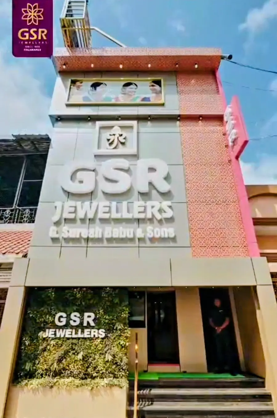 The GSR Jewellers building on Lakshman Singh Street: three storeys, pink lattice and cream stone, with framed portraits above the sign and a green wall at street level.